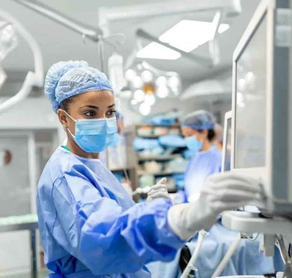 Doctor preparing for surgery while using a Hospital POS System, representing AI-powered reporting and analytics for hospital management.